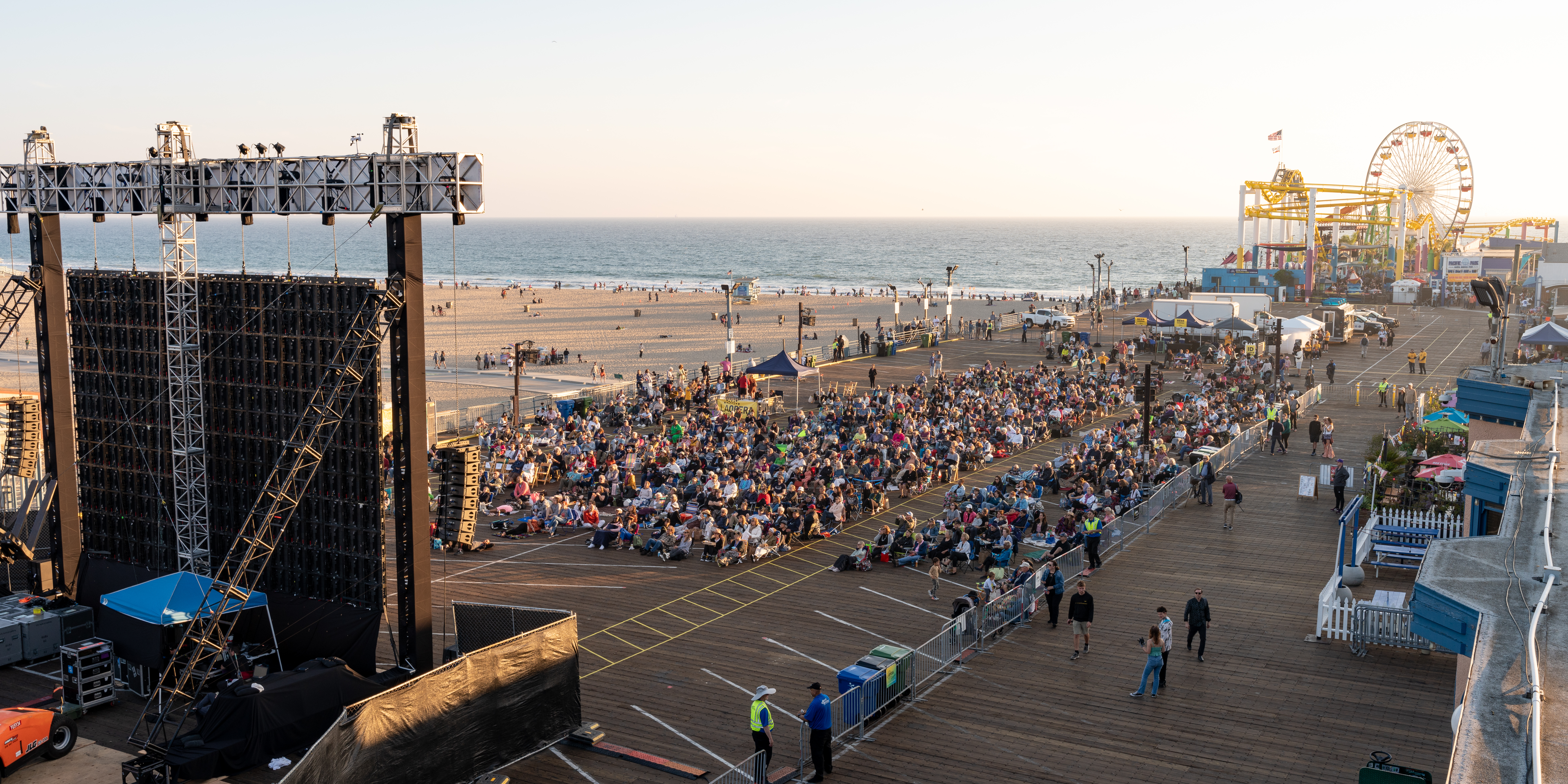 People viewing an opera on the beach