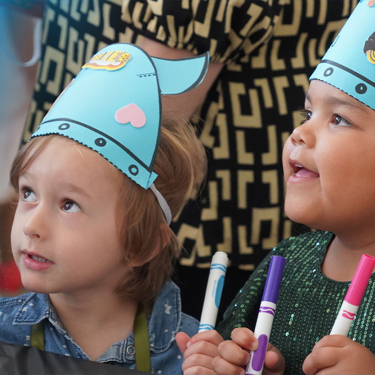 Children doing opera-themed arts and crafts